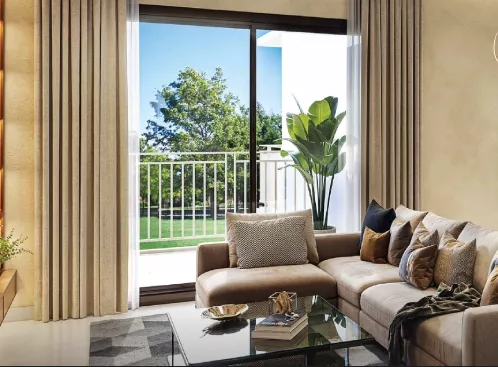 Furnished living and dining room interior at Ashiana Aaroham apartment