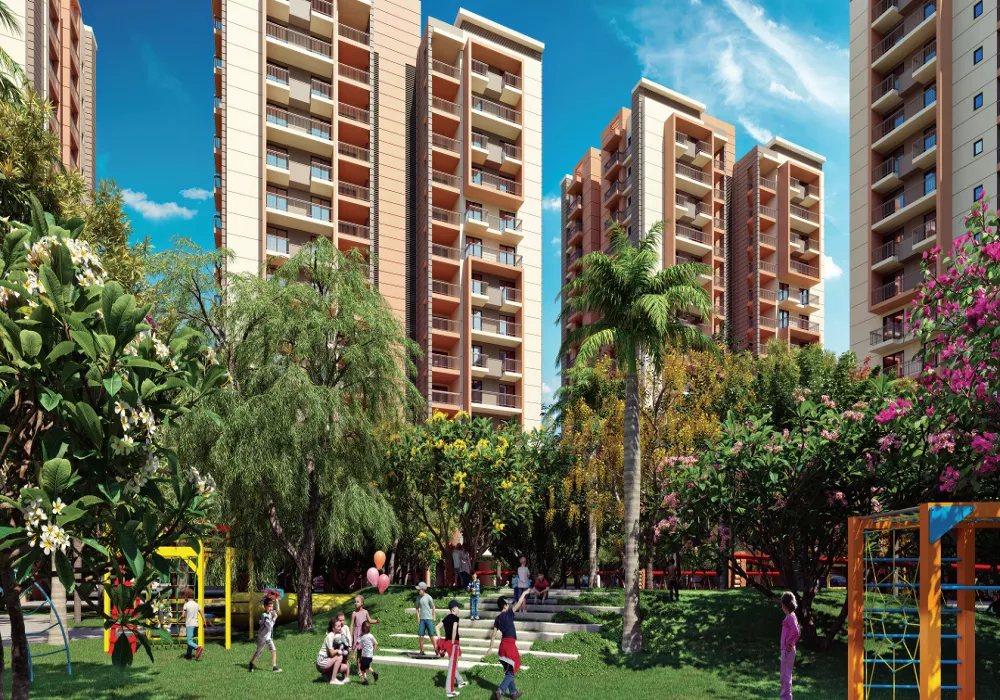 Ashiana Amarah landscaped garden with children's play area and apartment towers
